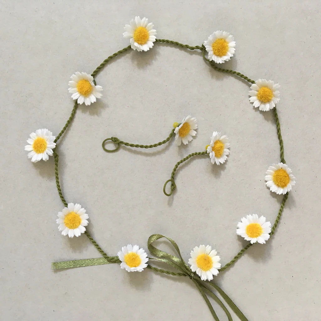 silk daisy chain on a grey background
