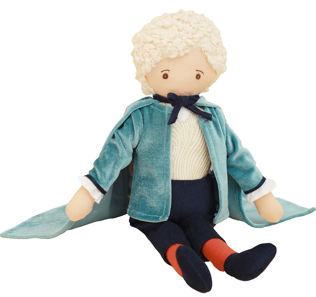 Toy Drosselmeyer ballet doll with a blue coat, cape and white hair on a white background