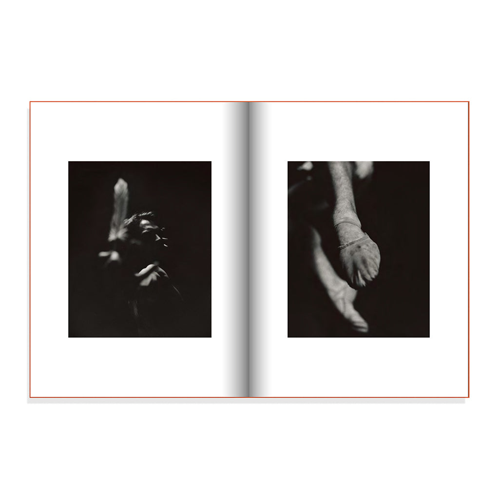 Drowning Light Book double page view of dancer Matthew Ball in the shadows and the dancers feet