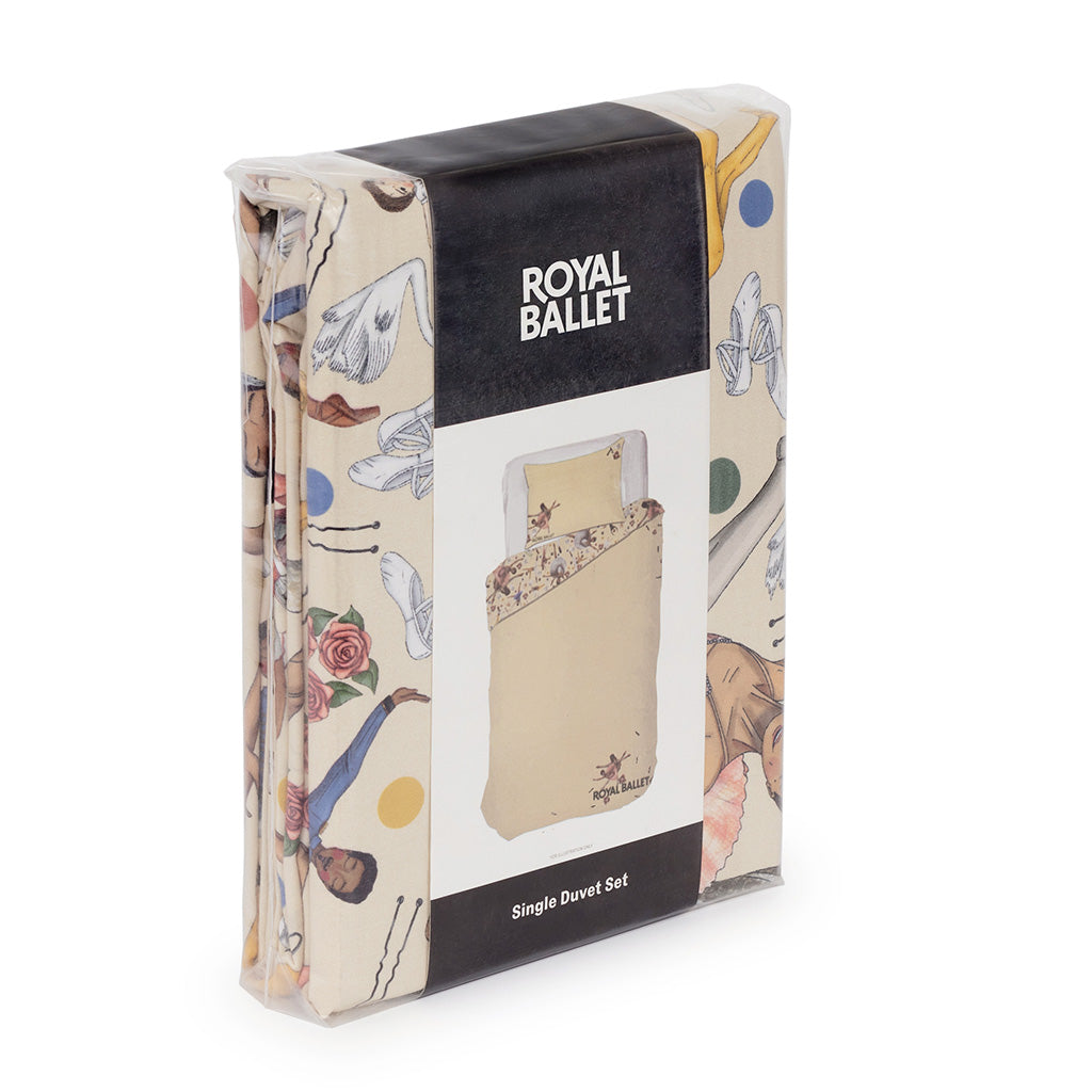 Royal Ballet Single Duvet Set in its retail packaging, featuring a cream duvet cover with a ballet illustrations , wrapped in a black and white paper sleeve.
