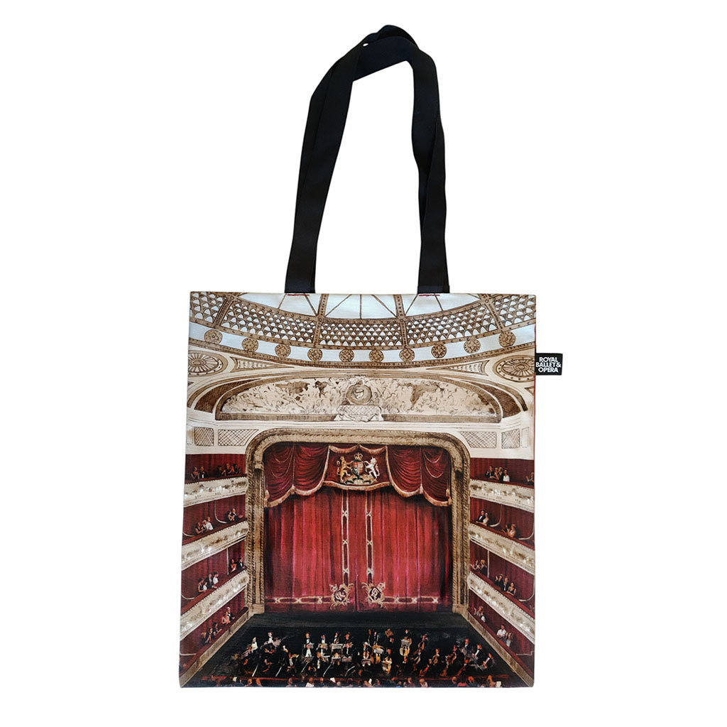 A tote bag featuring a painting of the Main Stage auditorium, capturing the iconic red velvet curtains, gilded frescoes, a glimpse of the orchestra, and the magnificent ceiling dome on a white background