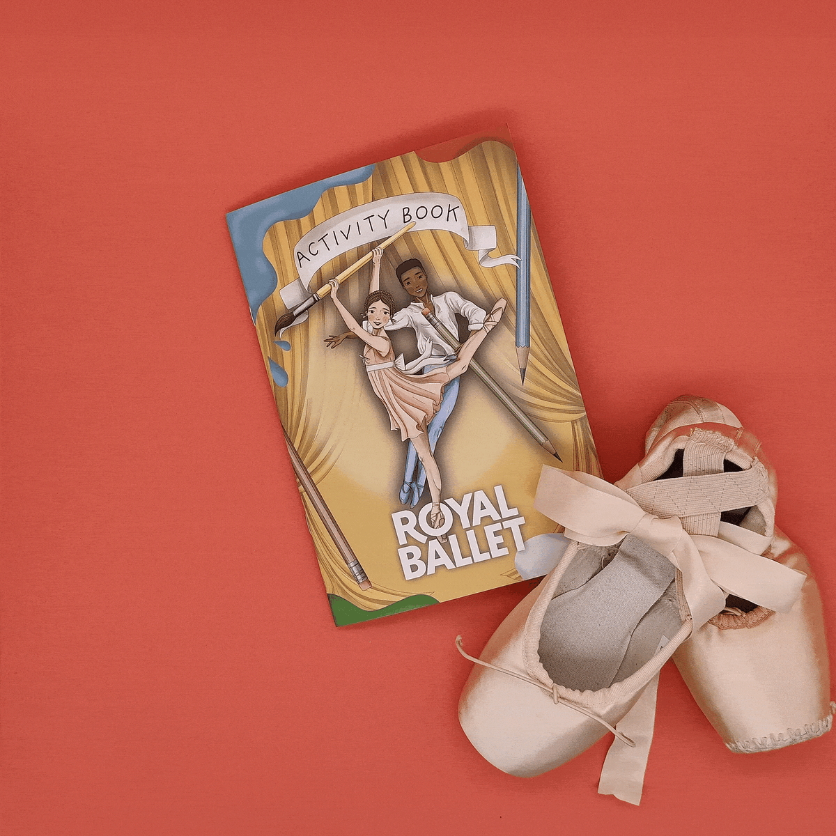 animated gif of the activity book opening next to a pair of ballet shoes