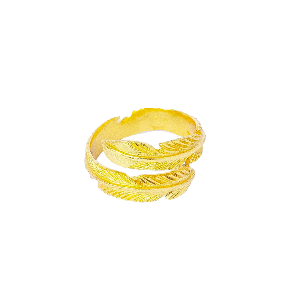 A gold plated feather ring with textured, ribbed detailing on a plain white background.
