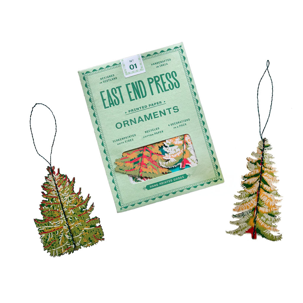 Decorative fur tree paper ornaments with packaging labeled &#39;East End Press&#39; on a white background