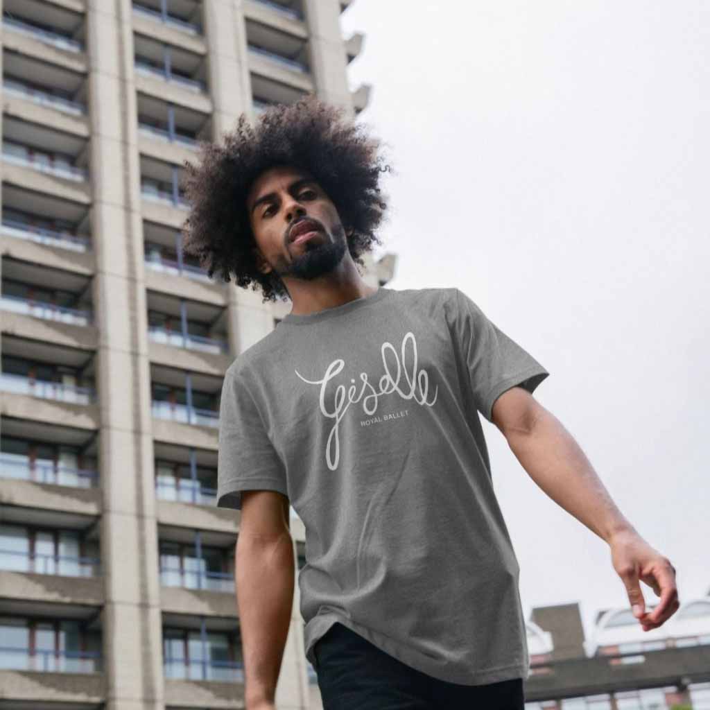 male model in grey giselle tshirt in front of a tower block