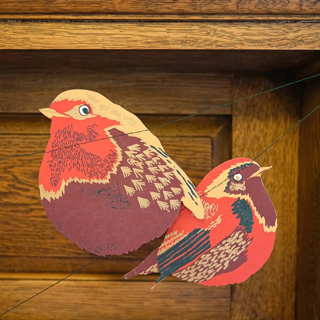close up of the hedgerow paper garland of two birds