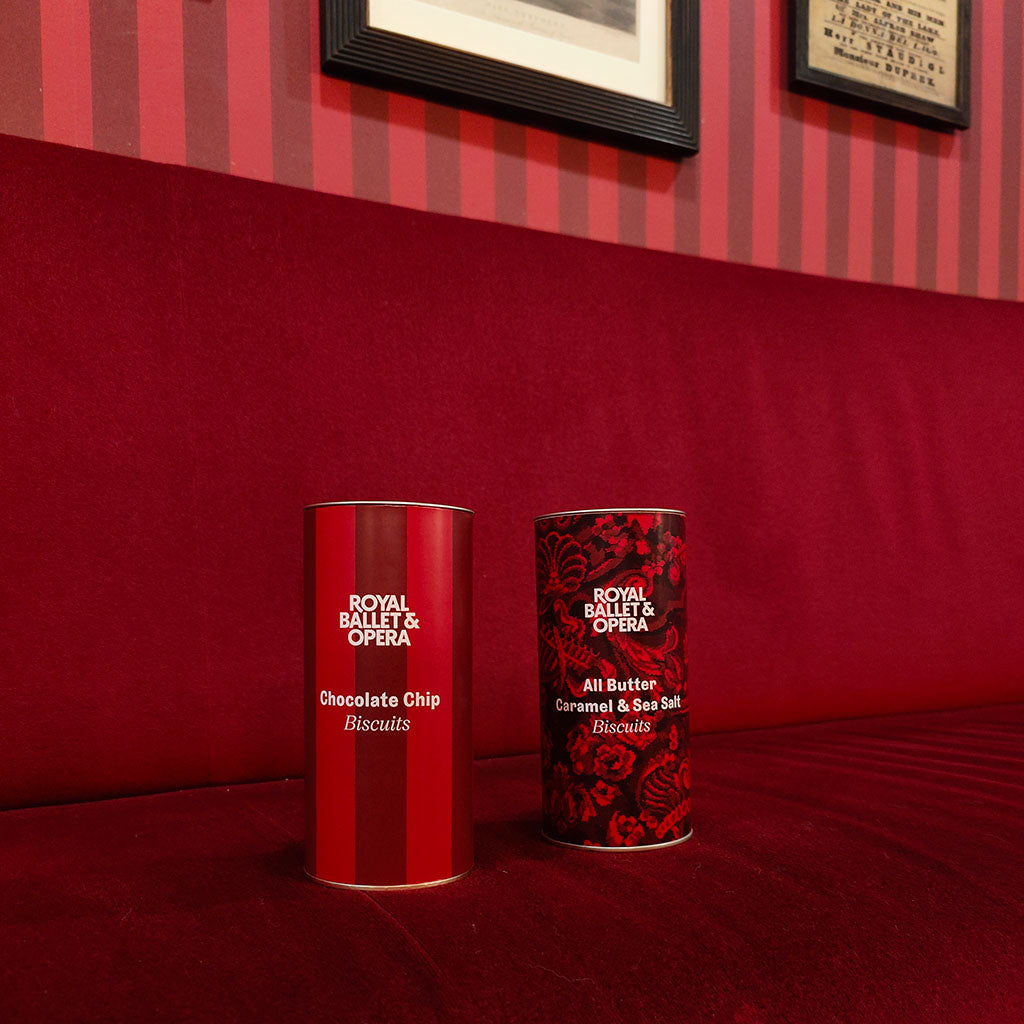 Stripped red tin of biscuits with 'Royal Ballet & Opera' branding on a white background