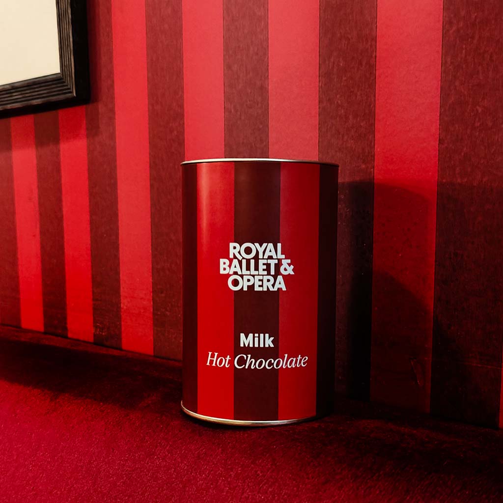 Red canister of Royal Ballet & Opera milk hot chocolate on a white background