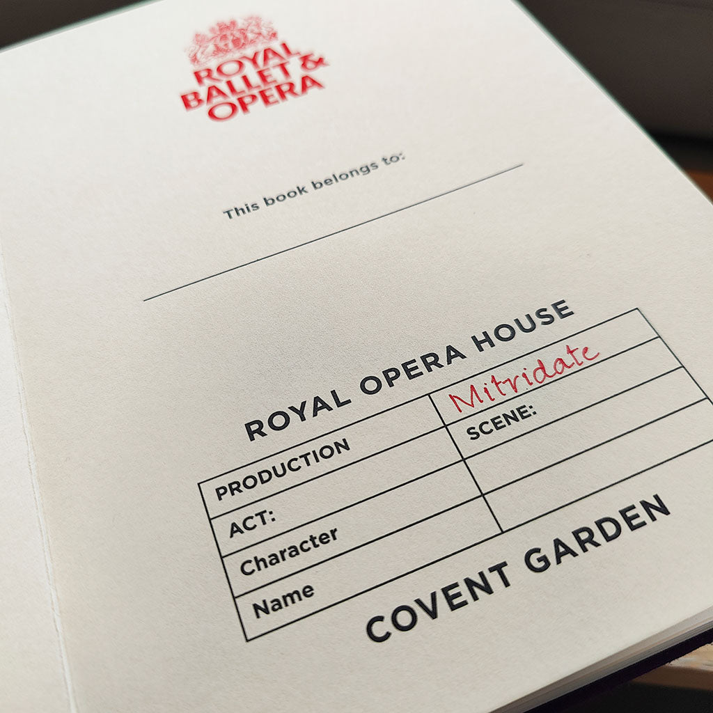 inside costume fabric notebook with royal opera house production name and logo