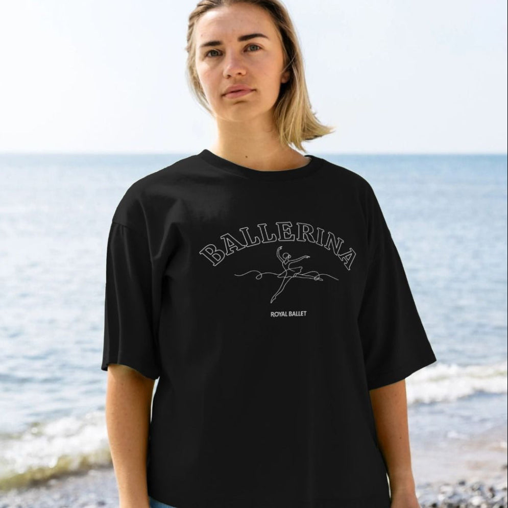 245519553 model wears black oversized t-shirt with white text BALLERINA ROYAL BALLET with dancer illustration on a white background