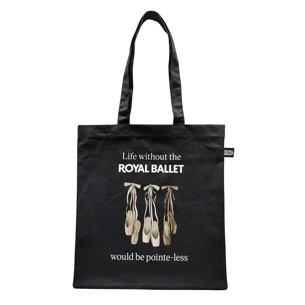 Black tote bag with ballet-themed design and text on a white background