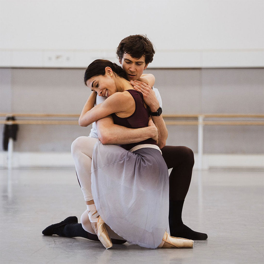 William Bracewell and Yasmine Naghdi  in an embrace in a rehearsal for Manon in a dance studio