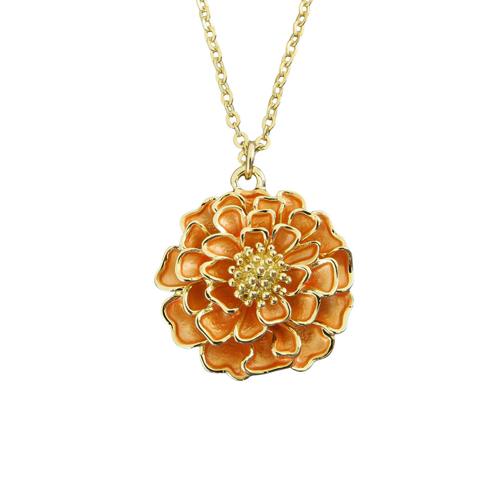 Gold and orange flower-shaped pendant on a chain against a white background