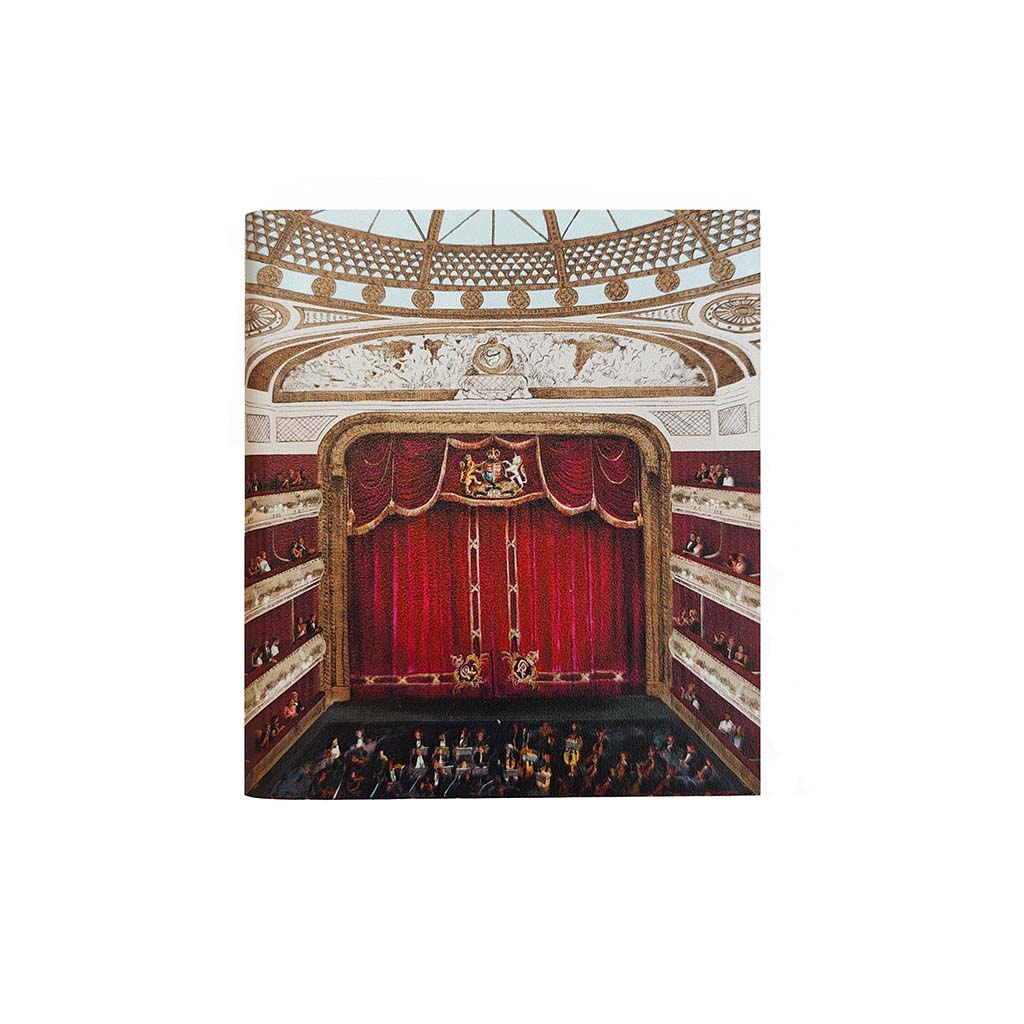 A mini notebook depicting a the auditorium at the Royal opera house  with a red velvet stage curtain, ornate gold and duck egg blue ceiling details, and an audience seated in the auditorium, shown against a plain white background.