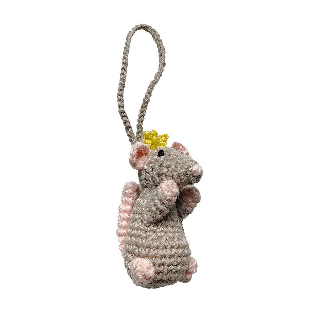 Crocheted mouse decoration with a crown on a white background