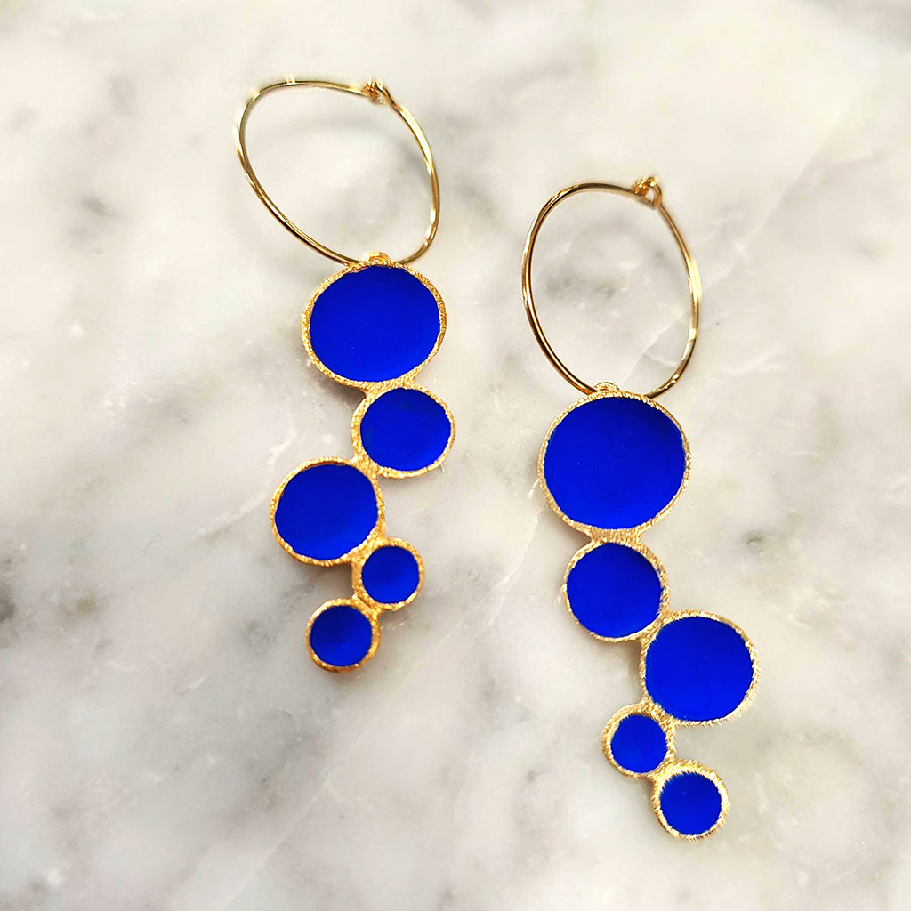 Multi Pod Hoop Earrings on a marble counter