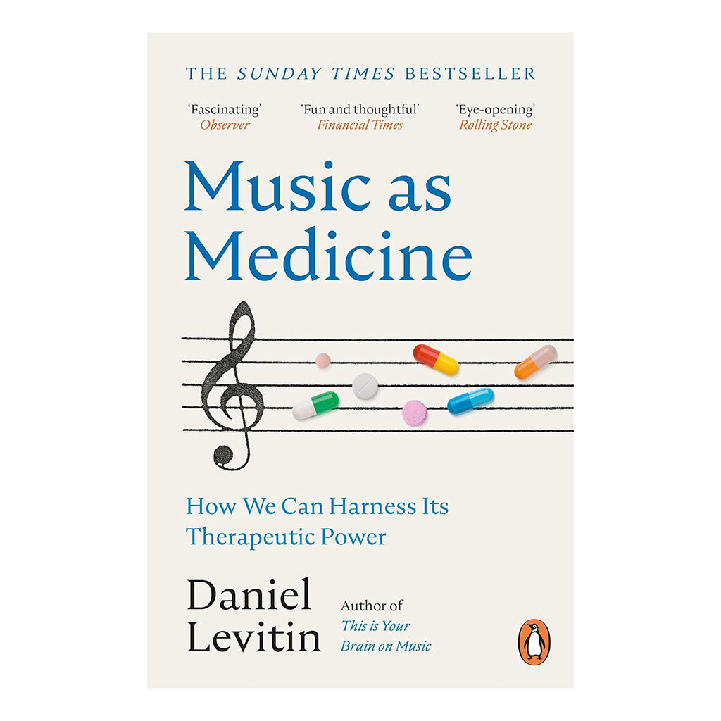 Front cover for Music as Medicine Book featuring tablets on a musical staff