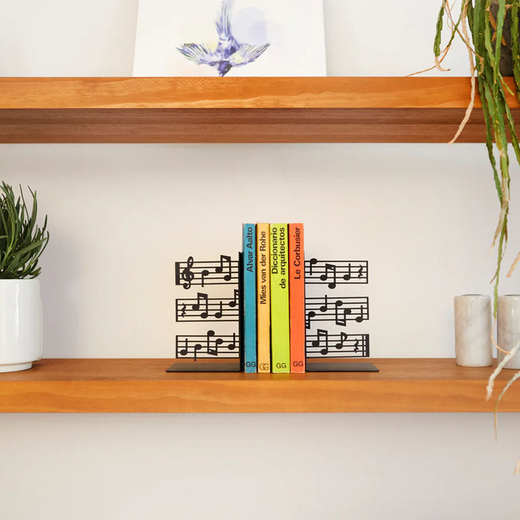 Metal bookends with music note designs on a white background
