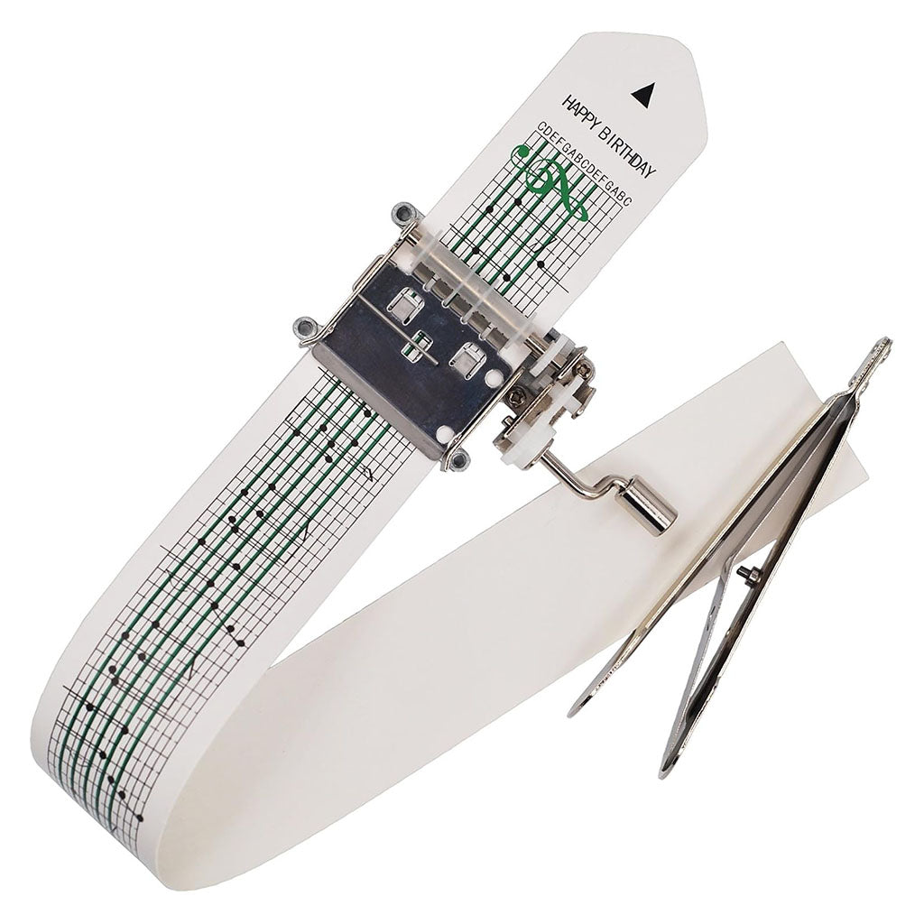 Mechanical music box with a white strip and green music notation on a white background