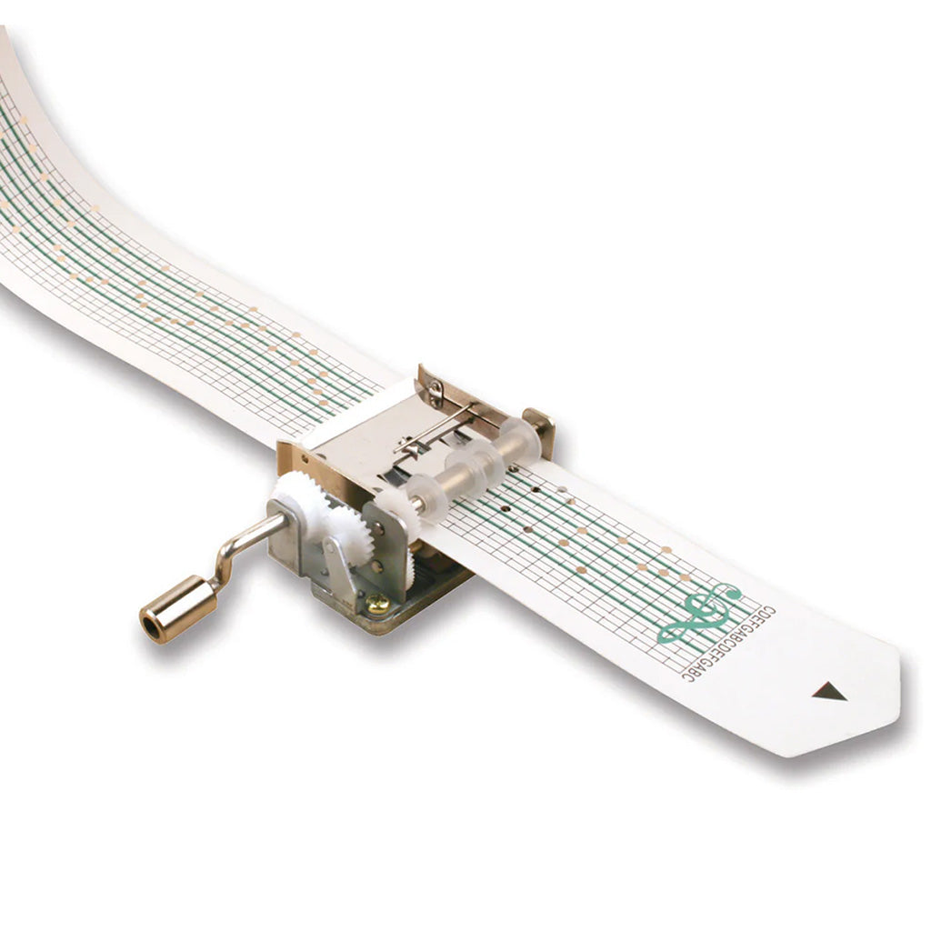 Mechanical music box with a white strip and green music notation on a white background