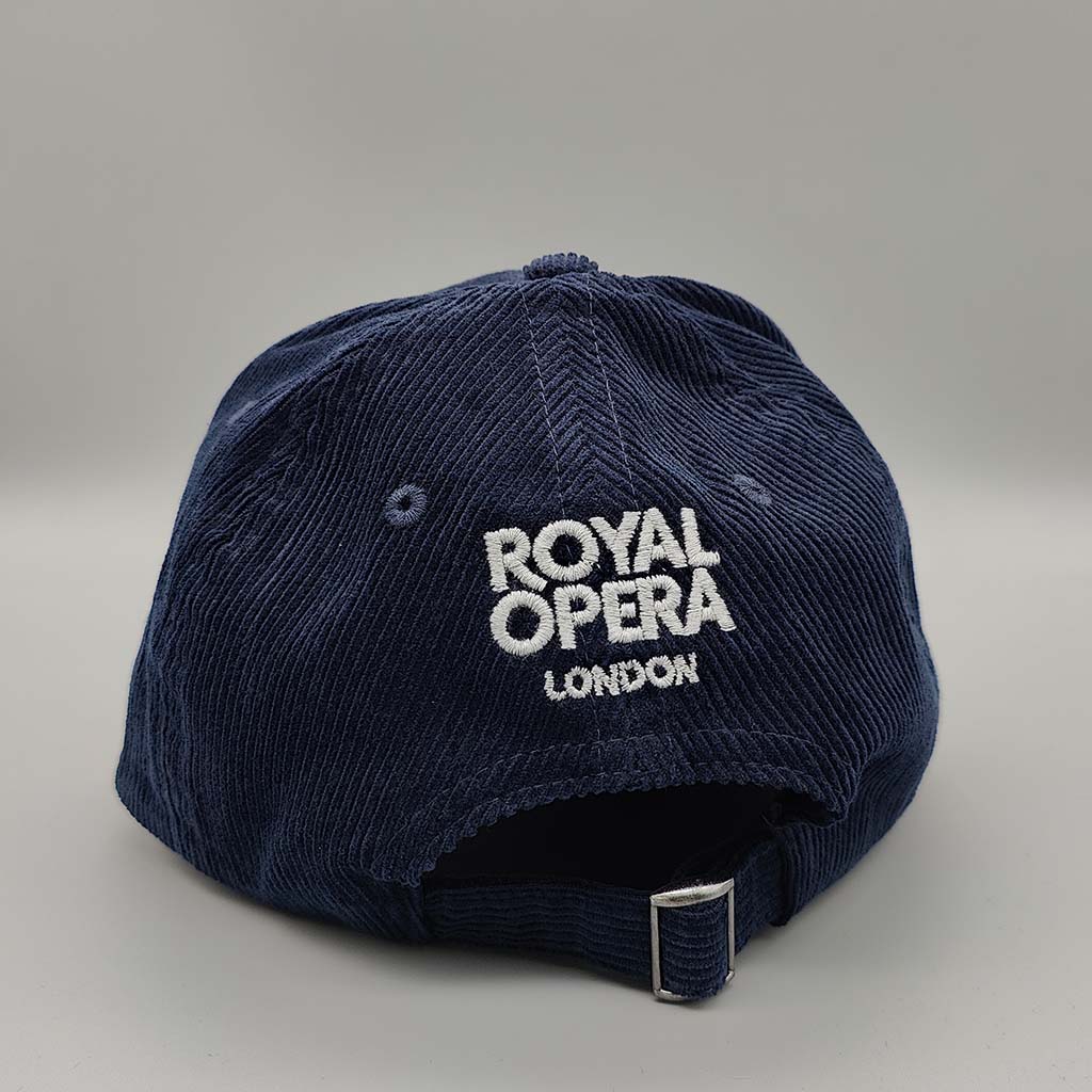 Navy blue cord cap with grey 'Royal Opera London' text on a gray background