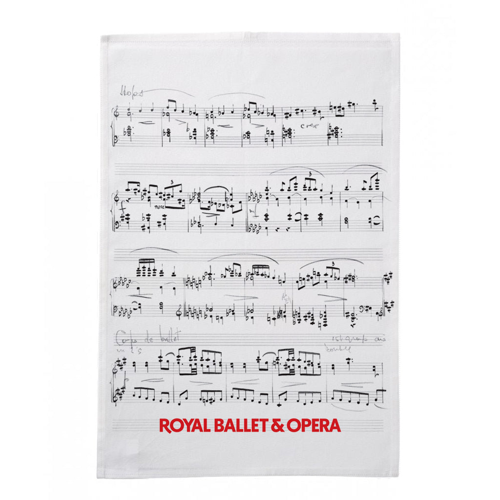 A white tea towel featuring printed musical sheet music across the front, with the text 'ROYAL BALLET &amp; OPERA' in red at the bottom, shown on a plain white background.