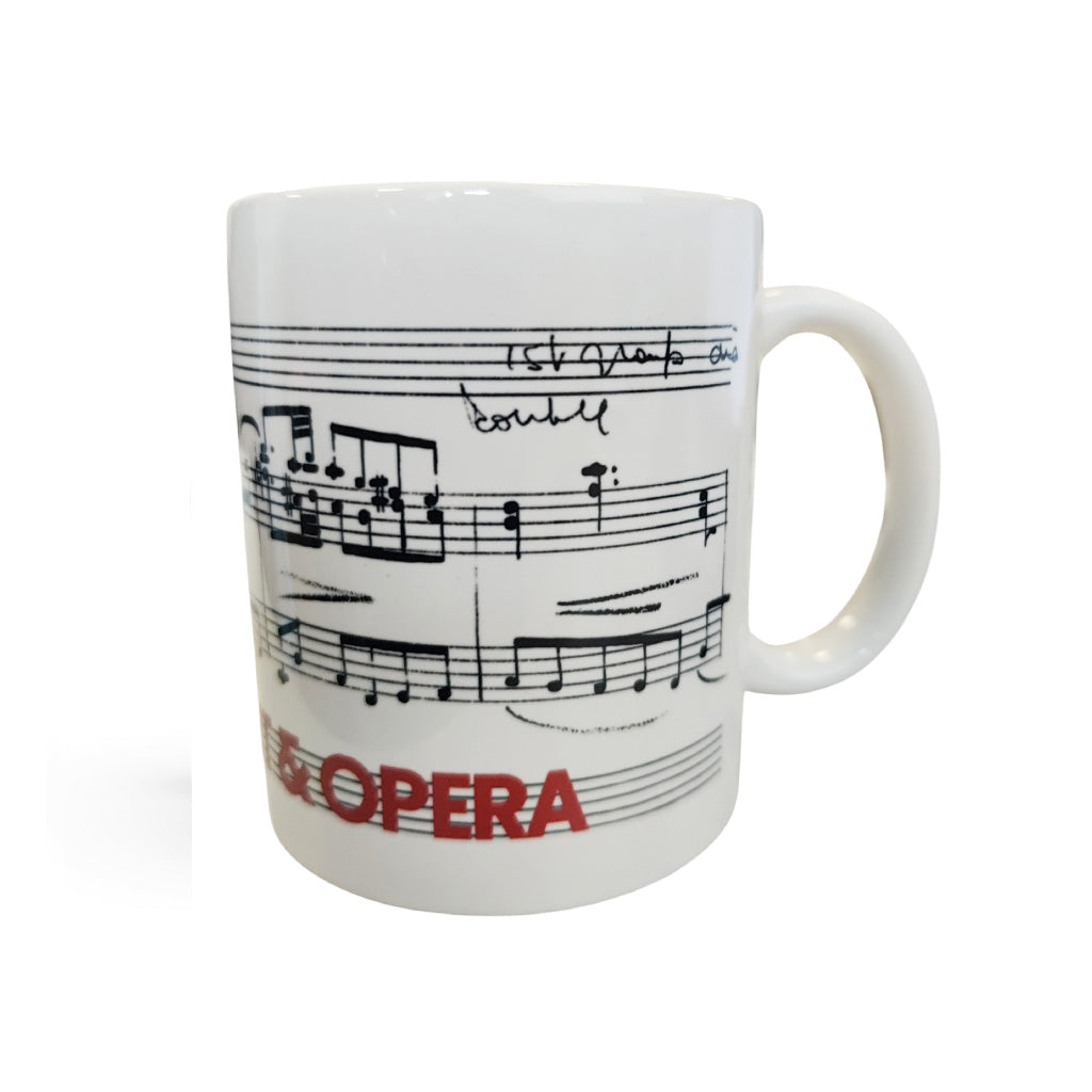 A white ceramic coffee mug featuring black musical notation and the word 'OPERA' printed in red, shown against a plain white background.