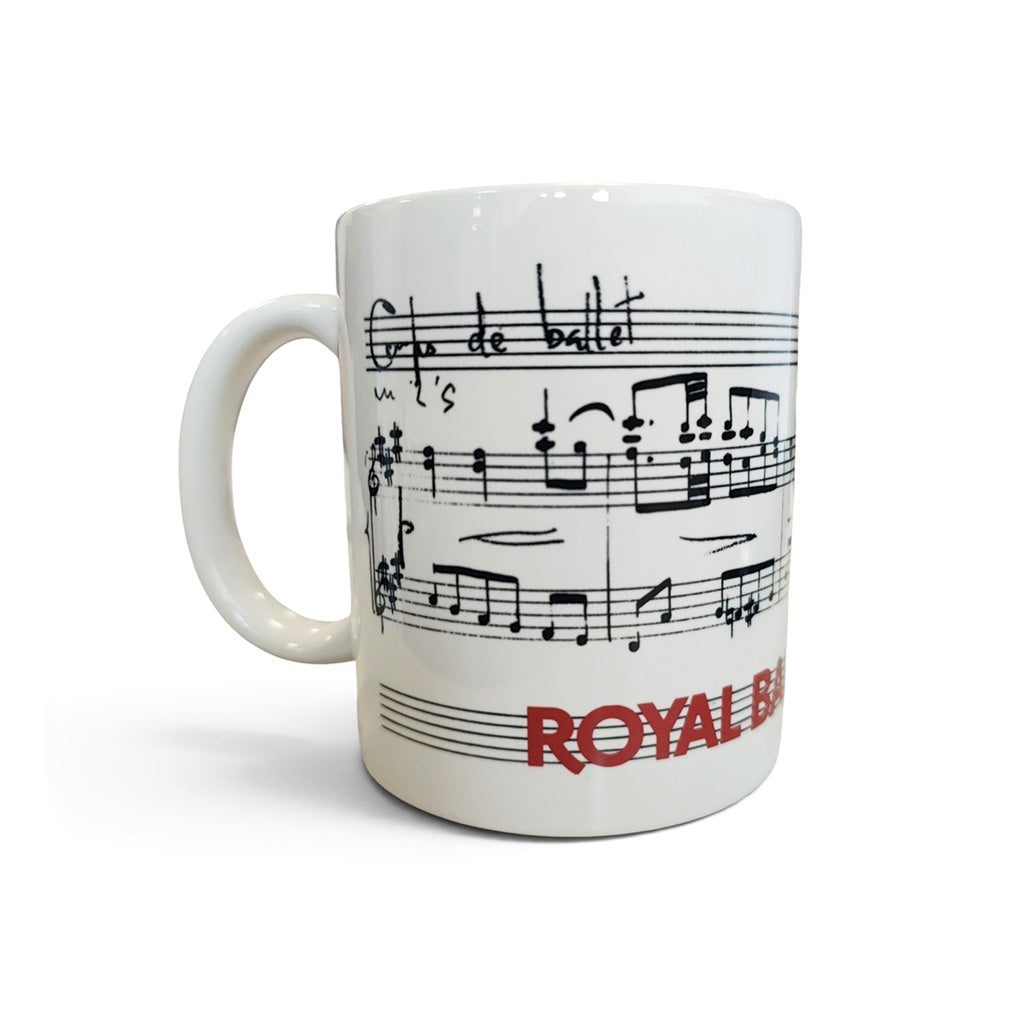 A white ceramic mug featuring a black musical staff and notes print with the red text 'ROYAL BALLET &amp; OPERA'.