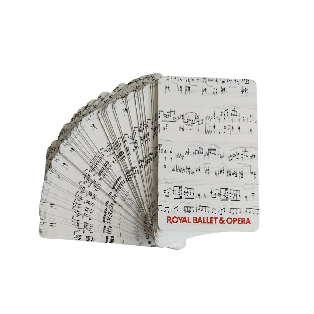 A deck of Royal Ballet &amp; Opera playing cards shown fanned out, with a white card face printed in black musical notation and red title text.