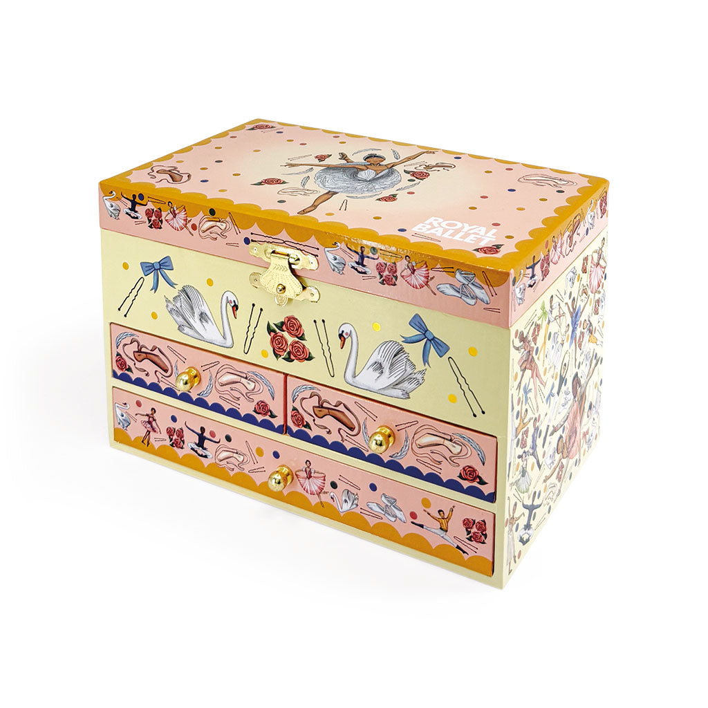 A decorative jewellery box with a whimsical ballet themed illustration on the lid and pastel pink drawer fronts, shown on a clean white background.