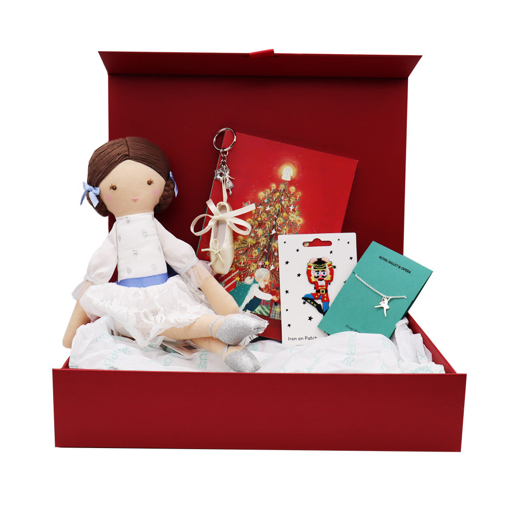 Nutcracker Gift Box including a clara doll, pink ballet shoe keyring, Ballerina Bracelet, Nutcracker Notebook and Iron on patch on a white background