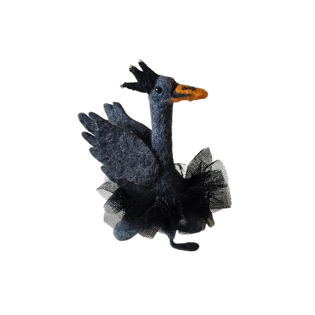 Black swan ballet decoration with orange beak and black tutu on a white background