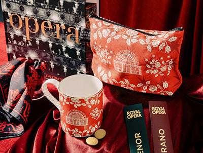 Opera book and bookmarks, with Rory Hutton mug and cosmetic pouch on red velvet