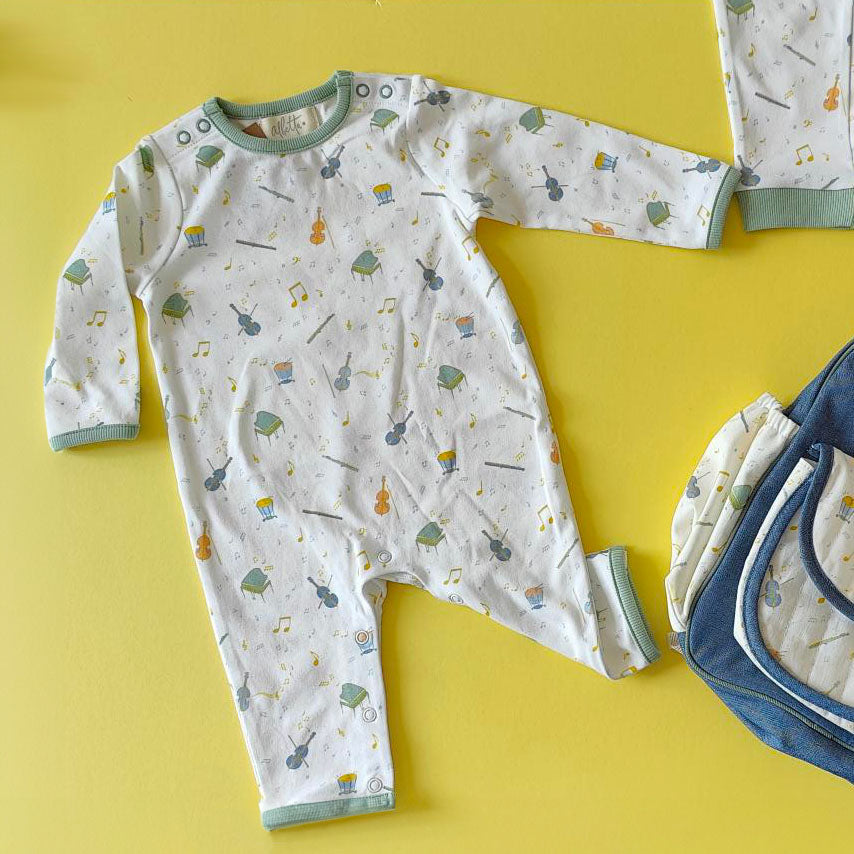 Orchestra Baby Grow  on yellow background