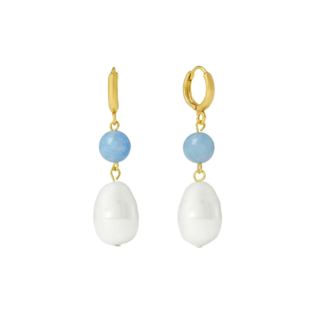 A pair of gold drop earrings featuring a small light bluestone, a larger teardrop-shaped pearl, and a small gold hoop earring at the top, shown against a plain white background.