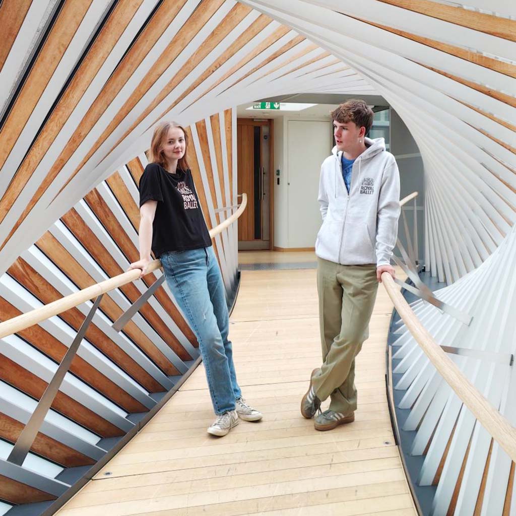 models in royal ballet hoodie and oversized t-shirt on the bridge of aspiration