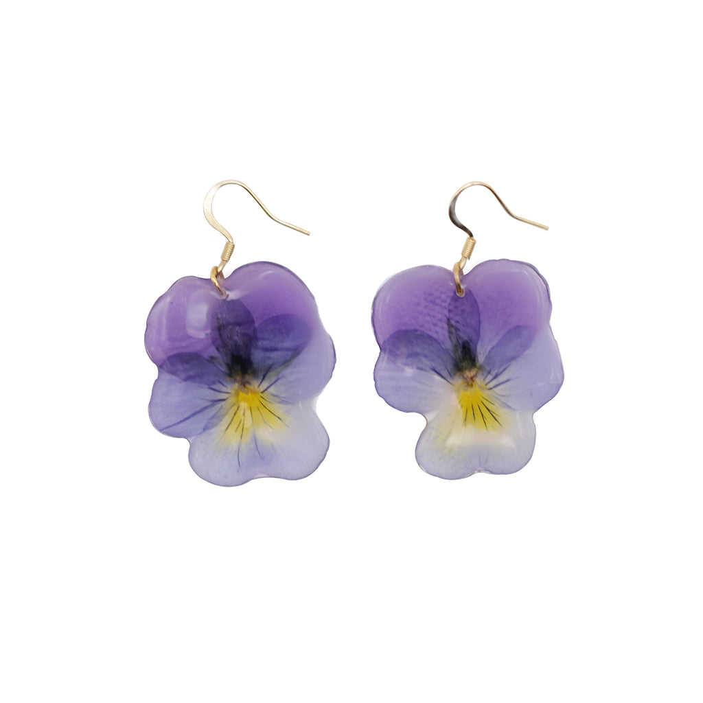 Purple flower-shaped earrings on a white background