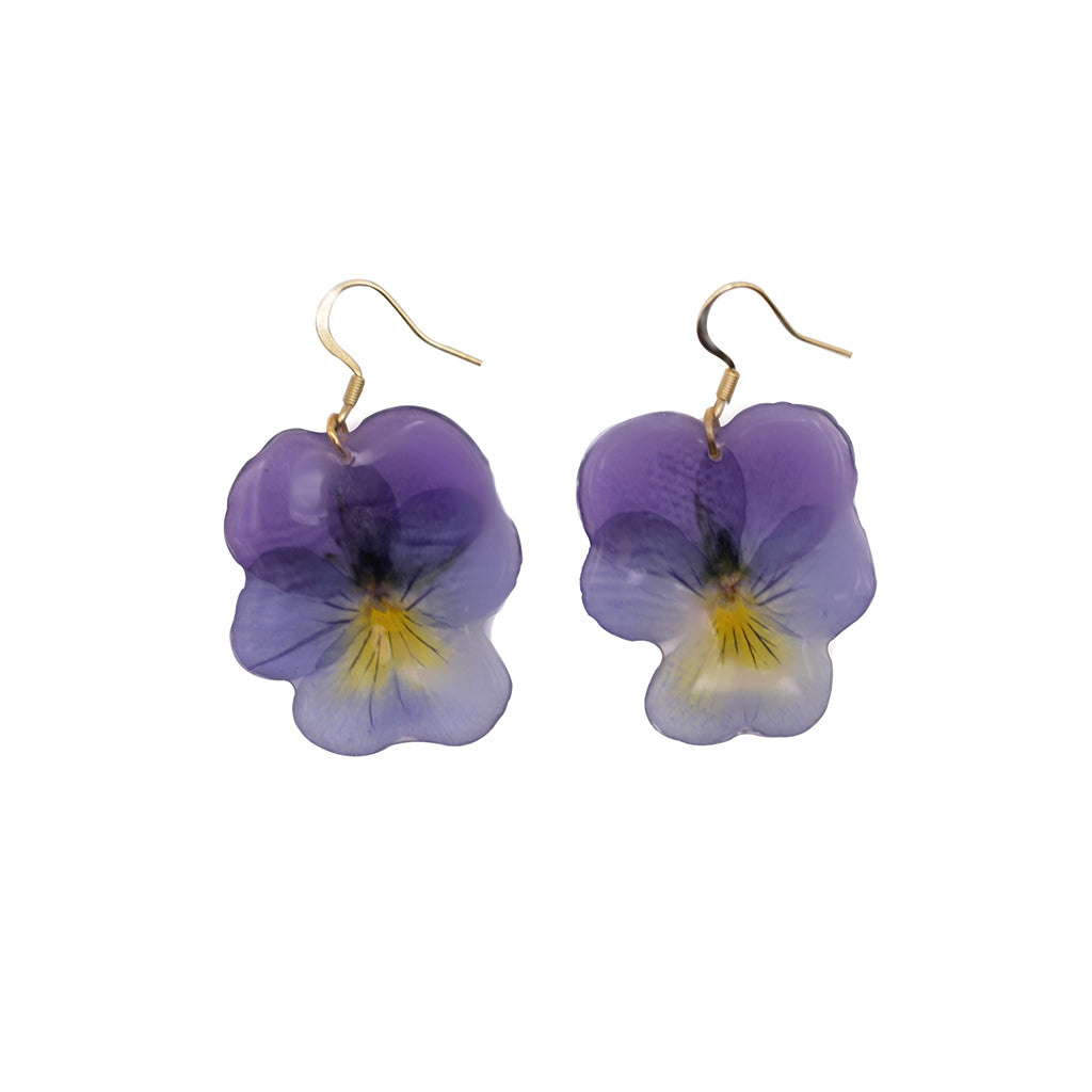 Purple and yellow flower-shaped earrings on a white background