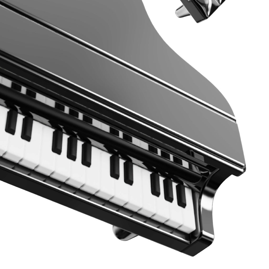 Close-up of a piano with black and white keys on a white background