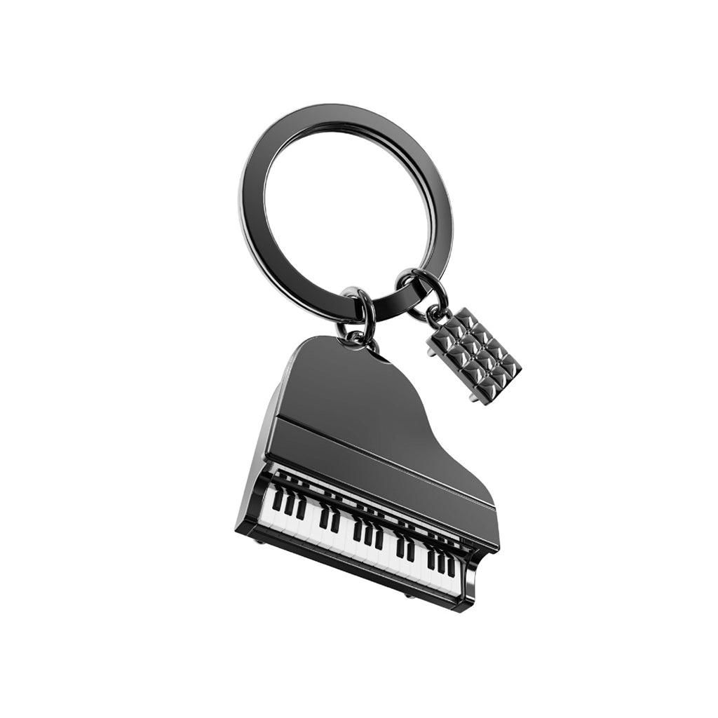 Piano keychain with a small piano stool charm on a white background