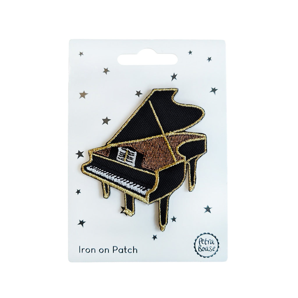 Grand piano iron on patch on a card backing made by Petra Boase on a white background