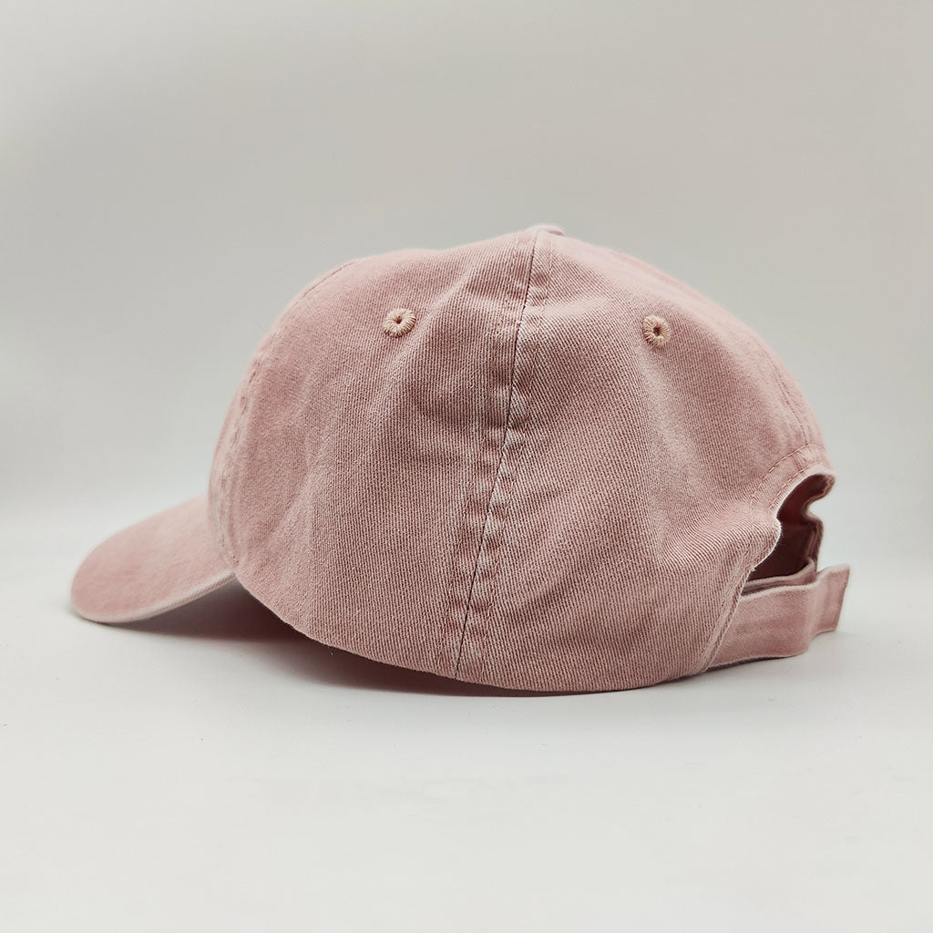 Pink cap with 'Royal Ballet London' text on a white background