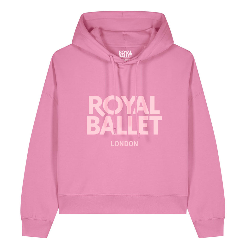 A pink pullover hoodie with 'ROYAL BALLET LONDON' printed in light pink text across the chest, shown on a plain white background.