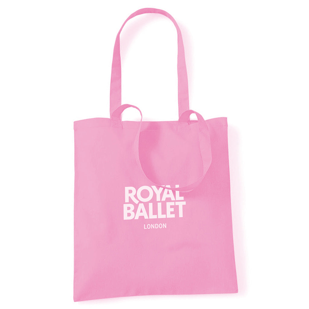 Pink tote bag with 'Royal Ballet London' text on a white background
