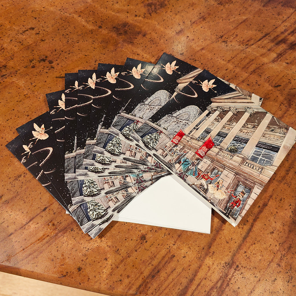 Set of christmas cards with architectural designs on a wooden surface