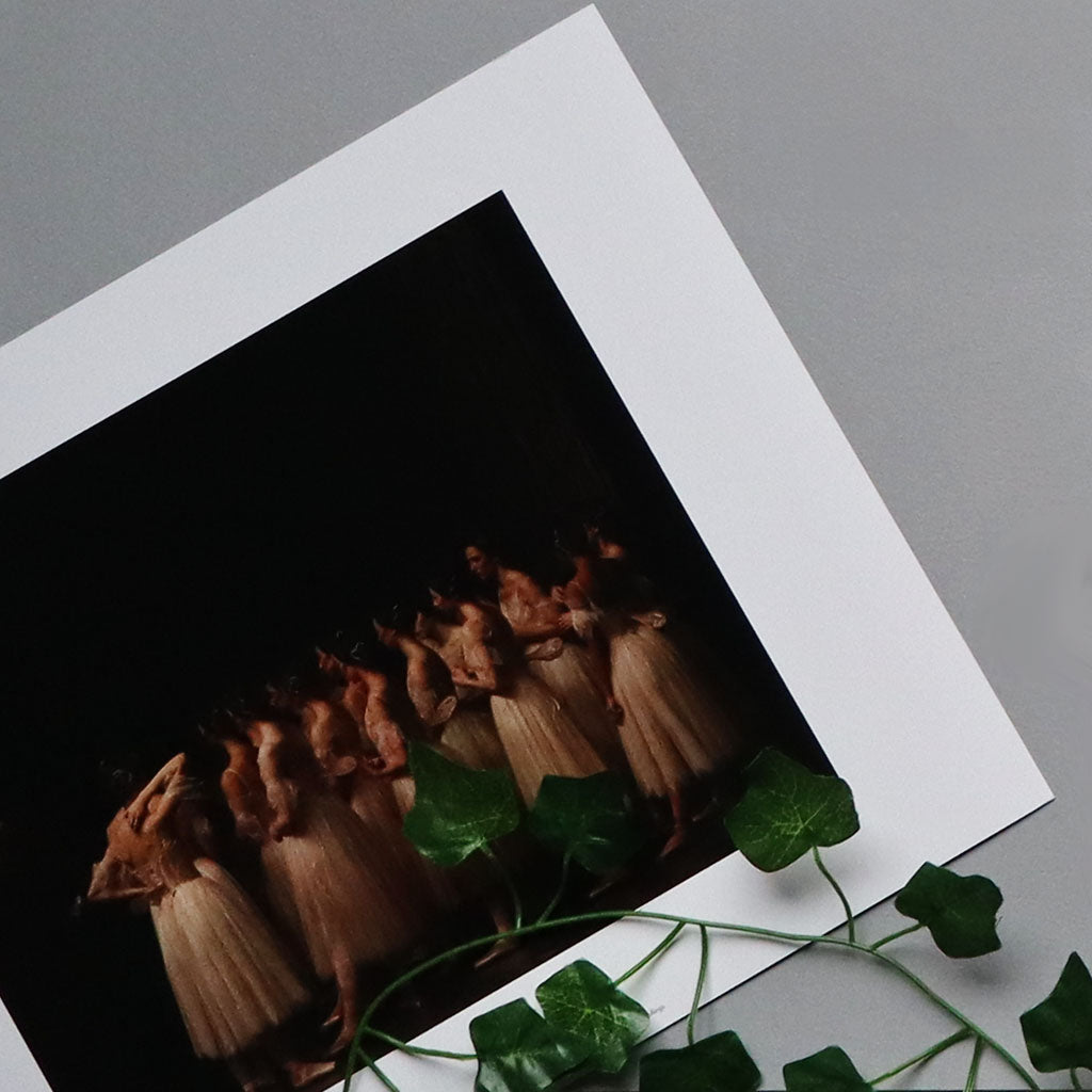 close up of Giselle rehearsal print with dancers in the wings
