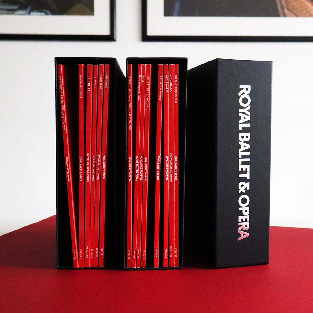 Set of red programmes inside Black programme folders  with 'Royal Ballet &amp; Opera' branding 
