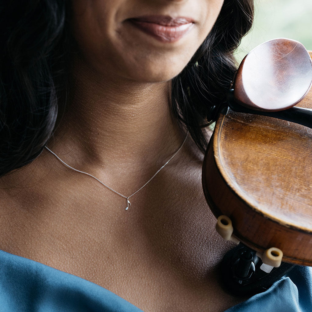 violinist wearing the quaver necklace