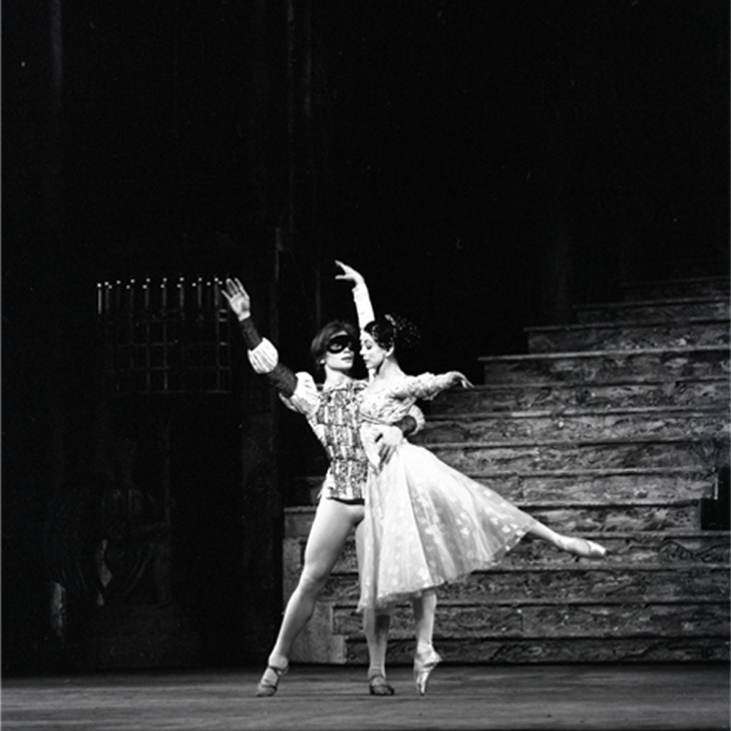 Close up of the Romeo and Juliet print of a black and white photograph of a dancers Margot Fonteyn and Rudolf Nureyev on stage with a dark background