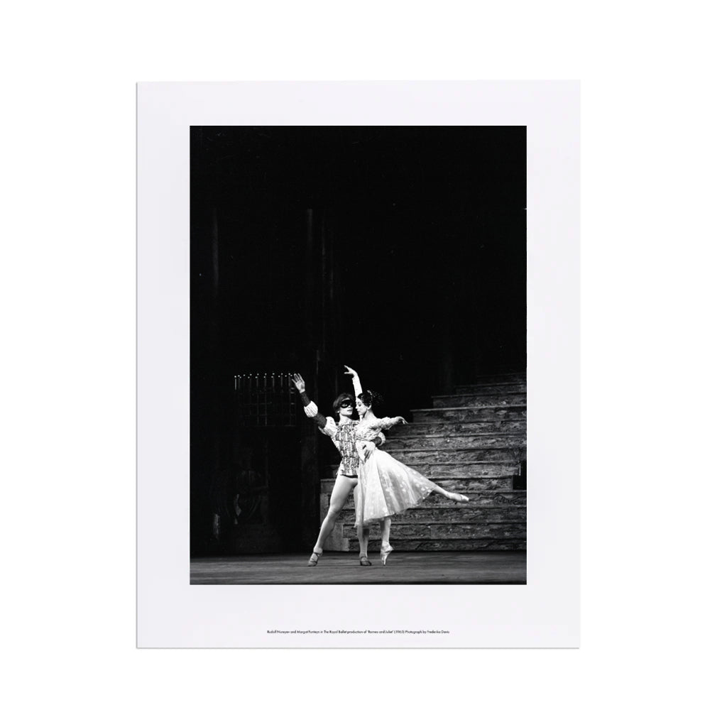 Print of a black and white photograph of a dancers Margot Fonteyn and Rudolf Nureyev on stage with a dark background